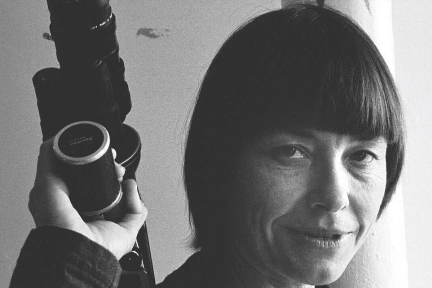 A photo of Barbara staring into the camera, her hair is short with a fringe, and the image is in black and white.